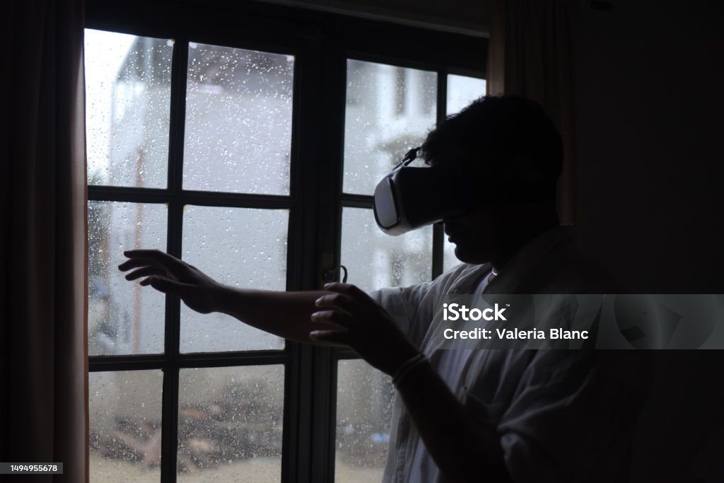 Man At Window Man By The Window Using 3d Technology Stock Photo - Download Image Now ...