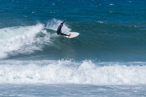 istock Surfer riding waves in Furadouro Beach 1494957789