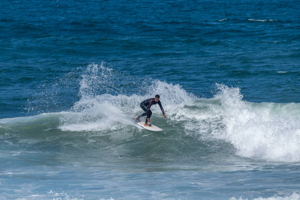 istock Surfer riding waves in Furadouro Beach 1494957823