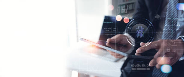 istock Businessman using tablet and fingerprint scanning to unlock and access business data network. Biometric identification and cyber security, data protection from online digital cyber attack 1494959280
