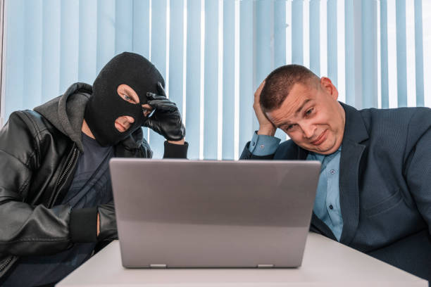 extortionist thief demands money in the businessman's office. theft of personal data. bank robbery. the concept of extortion and robbery. - extortionist imagens e fotografias de stock