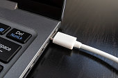 Close-up photo of laptop type-c port, type-c hub and type-c cable. Without persone