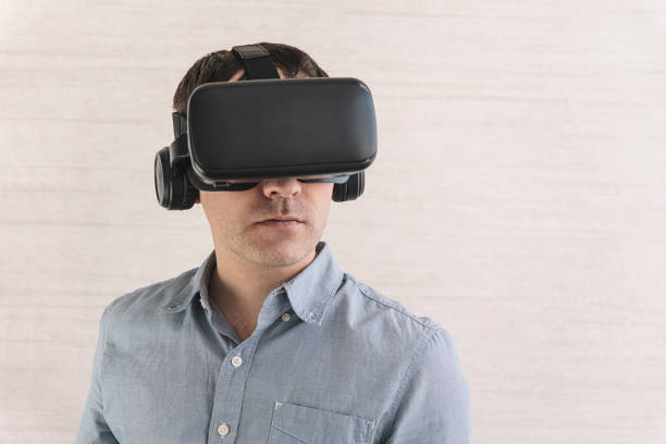 Handsome man wearing future technology VR glasses. 360 degree video viewing