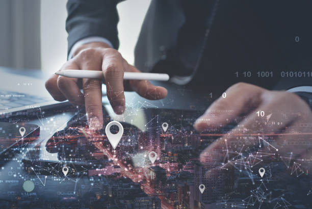 istock GPS map, pin address location on mobile apps. Double exposure of man hand using digital tablet searching target place on cityscape, smart logistic, global business technology  concept 1494970067