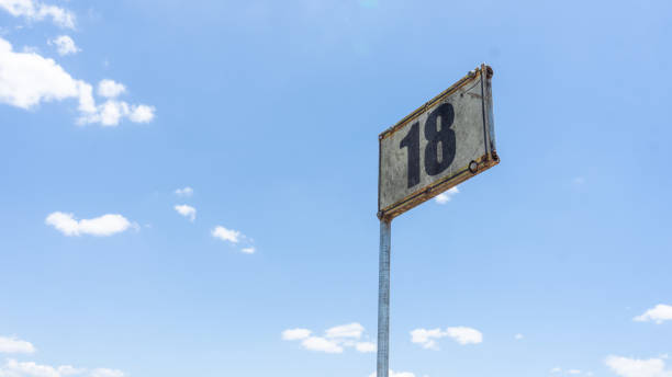 Sign of a cattle pen with the number 18