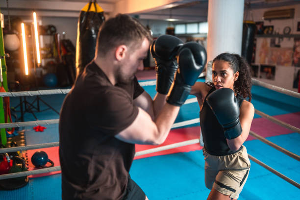 istock Diverse Male And Female Boxers Spar Fighting 1494981685