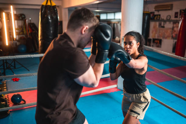 istock Diverse Male And Female Boxers Spar Fighting 1494981690