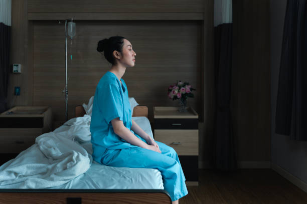 istock Long term patient with special treatment care plan is lonely sitting with depression while looking out the window for hopeful recovery progress and ptsd concept 1494983944