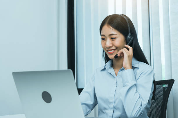istock Close up call center worker was smiling at his office. 1494988298