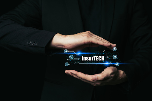 Insurance technology (Insurtech) concept, Hand of business man protection insurance technology.