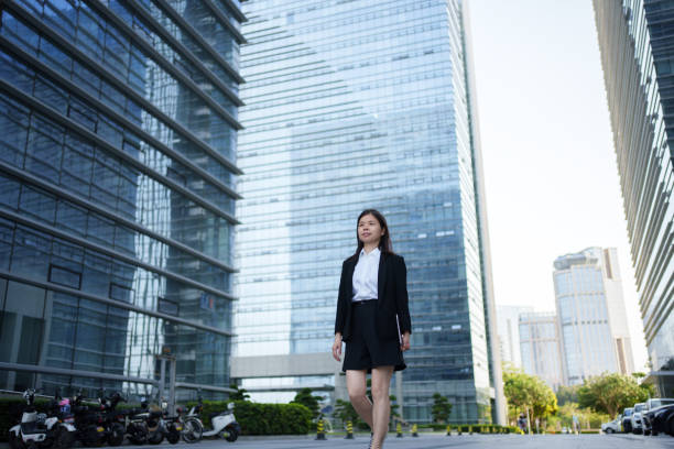 istock businesswoman outside office building 1494992616
