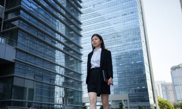 istock businesswoman outside office building 1494992617
