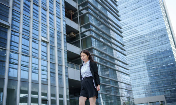 istock businesswoman outside office building 1494992618