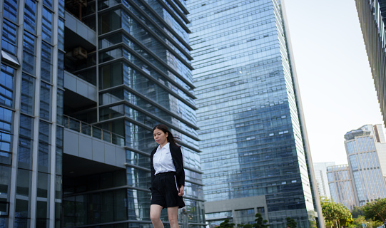 businesswoman outside office building