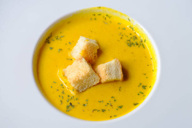 istock creamy corn soup on white plate , top view 1494999054