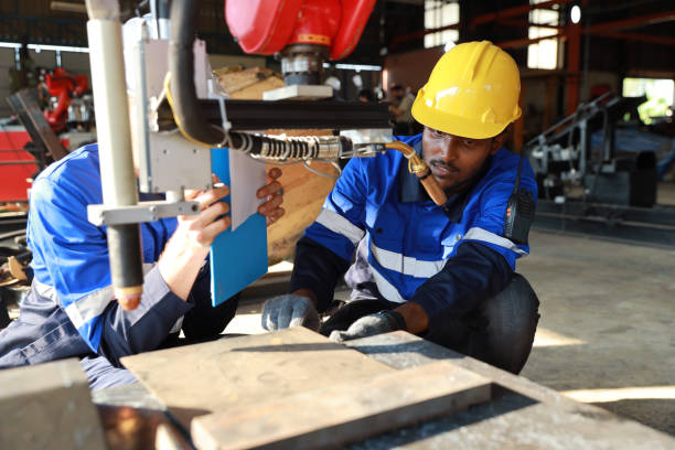 istock Professional heavy industry technician engineer in safety workwear maintenance and check part of robot arm machine in intelligent factory automotive. Industrial and technology support system concept 1495002413