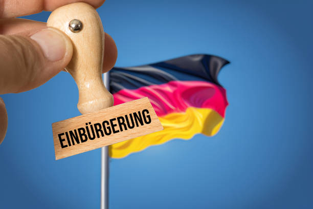 Flagge von Deutschland und Stempel Einbürgerung