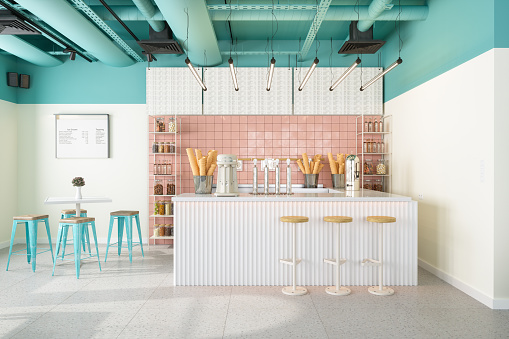 Ice Cream Shop Interior With Table, Stools, Turquoise Ceiling And Ice Cream Flavors On Display.