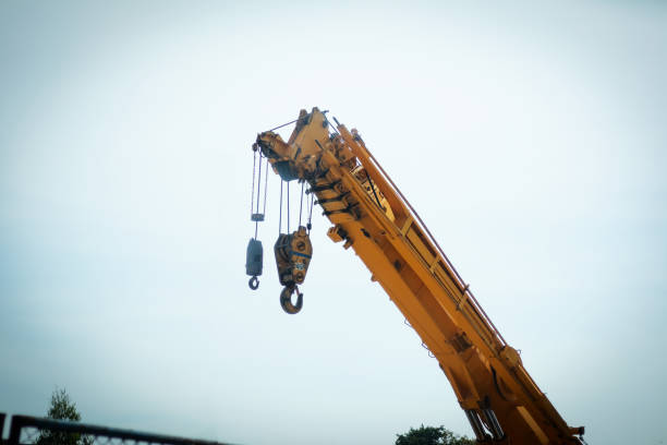 istock the hook block of the mobile crane and slinging that inspector inspected before starting work, the main construction built is heavy equipment. 1495004101
