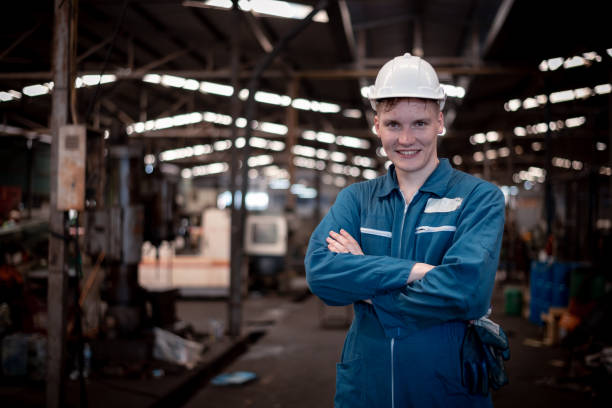istock Portrait engineer worker industry wearing safety uniform pose standing at factory workplace with industry hi -machine background 1495012615
