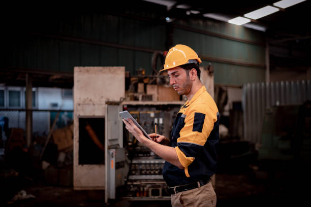 istock Portrait engineer worker industry wearing safety uniform pose standing at factory workplace with industry hi -machine background 1495012864