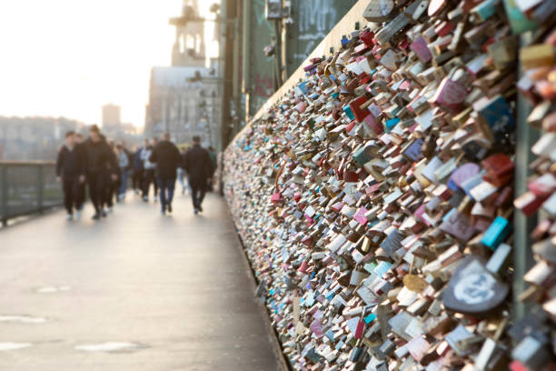 Love locks on the Hohenzollern Bridge in Cologne, Germany -  A railway and pedestrian bridge crossing the river Rhine.
