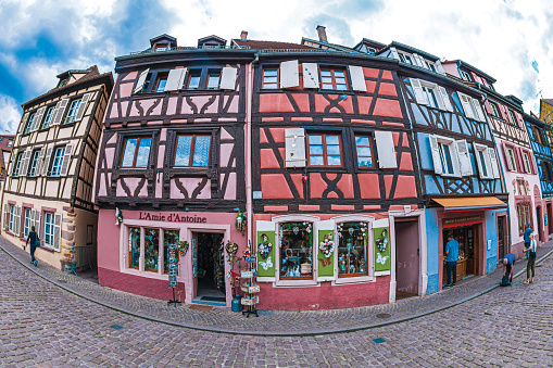 Colmar: Traditional Alsatian souvenirs shops, with cheerful and romantic decorations on the facade, located in a medieval house with typical architecture of the area in old town.