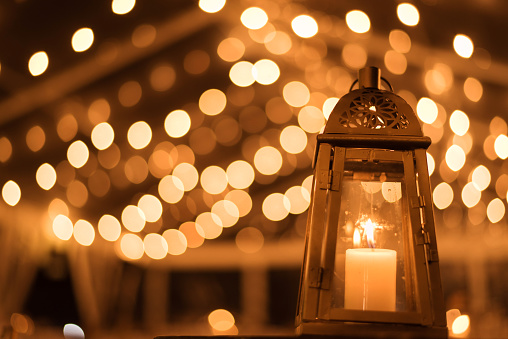 Beautiful Close view of  a candle lamp with a bokeh background