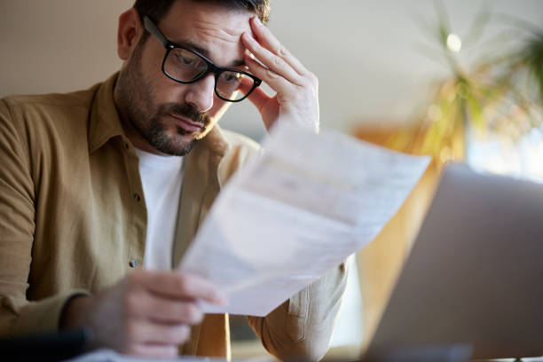 istock Worried man working on home finances. 1495021180