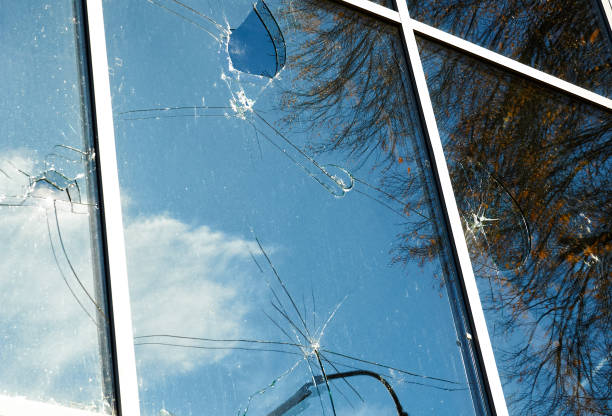 istock Broken blue window in a high-rise building. 1495024869