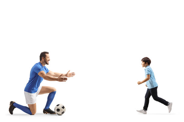 istock Football player waiting to hug a boy 1495025054