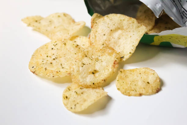 istock Spilled potato chip snack packaging, isolated over white background 1495030603