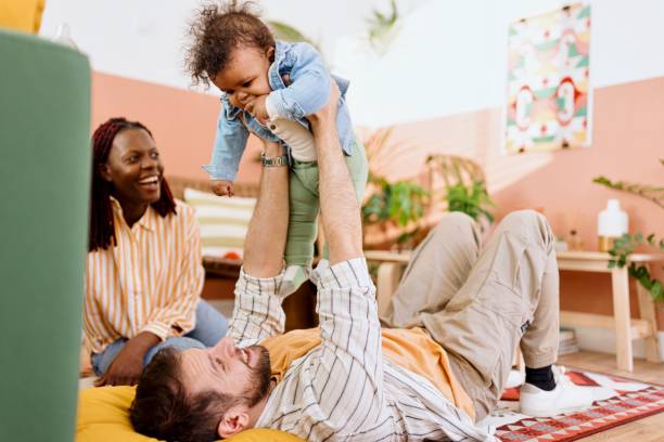 istock Loving father playing with his son at home 1495032374