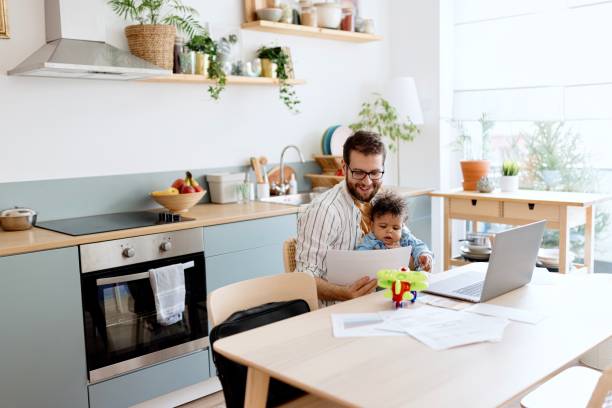 istock Happy father paying bills online 1495032426