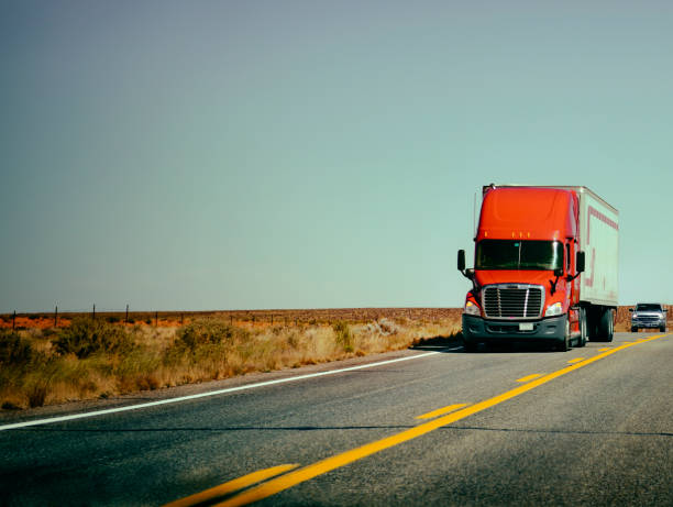 istock Red Truck on Highway. 1495032685