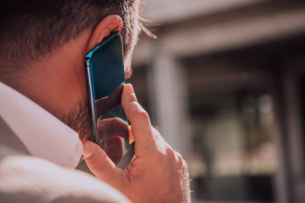 istock A businessman using his smartphone outdoors, showcasing the seamless integration of technology and mobility in modern professional life. 1495033636