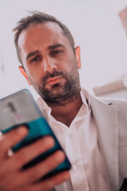 istock A businessman using his smartphone outdoors, showcasing the seamless integration of technology and mobility in modern professional life. 1495033855