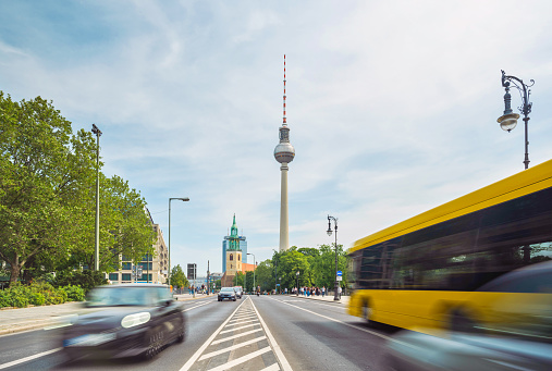 long exposure of cars and bus in central berlin with TV -Tower in the background
