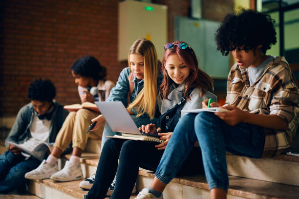 istock Multiracial group of high school students learning in a hallway. 1495038094