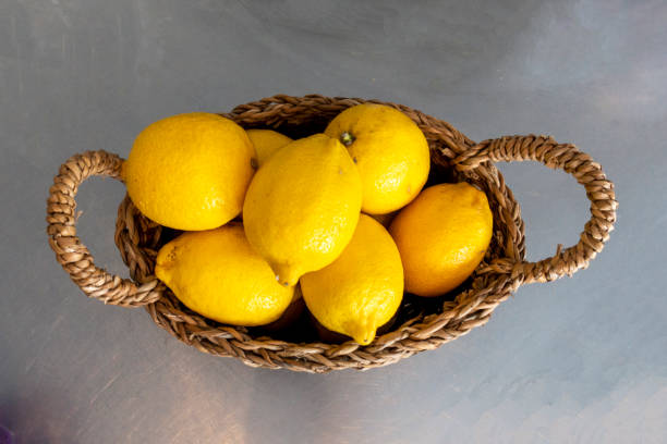 Table decor with baskets full of lemons Table decor with baskets full of lemons moses basket stock pictures, royalty-free photos & images