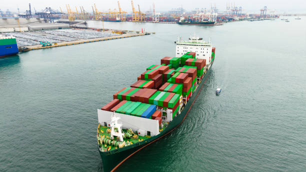 istock aerial view cargo container ship sailing in sea to import export goods transportation and commercial port background 1495042910