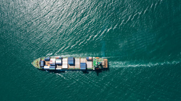 istock container ship floating in green sea, business and industry Transportation cargo logistics services of international by container ship in ocean 1495042934
