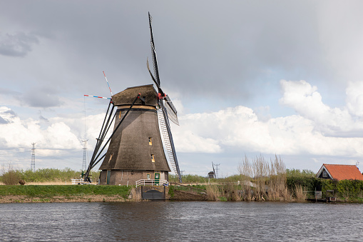 The windmills at Kinderdijk are a group of 19 monumental windmills in the Alblasserwaard polder, in the province of South Holland, Netherlands. Most of the mills are part of the village of Kinderdijk in the municipality of Molenlanden, and one mill, De Blokker, is part of the municipality of Alblasserdam. Wikipedia