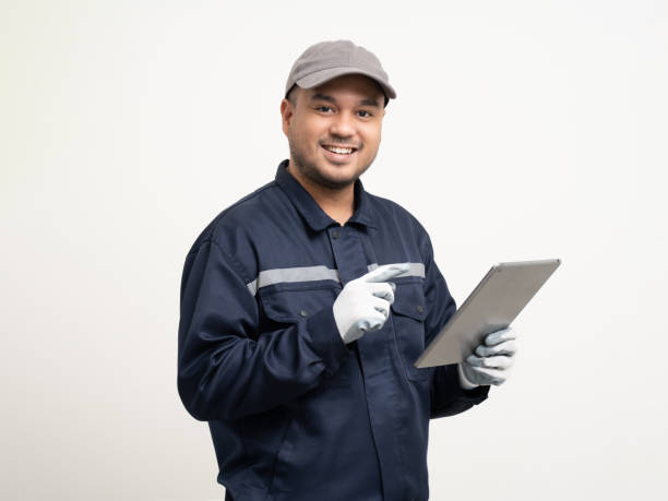 istock Technician workers in uniform maintenance service with tablet. Profession of service industry house repair. Home services isolated background. 1495045074
