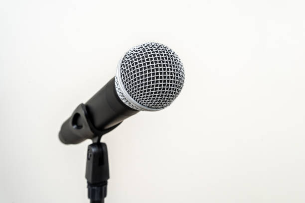 istock Microphone with stand on isolated white background for singer and speaker. Wireless microphone. High quality dynamic microphone 1495045443