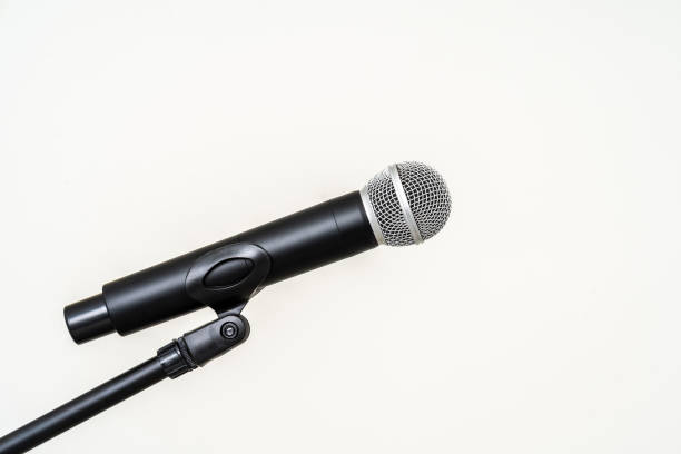 istock Microphone with stand on isolated white background for singer and speaker. Wireless microphone. High quality dynamic microphone 1495045444