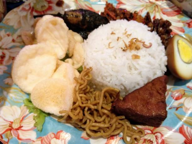 istock Mixed rice is a typical Indonesian dish. which consists of white rice served with various side dishes. The side dishes used include fried chili sauce 1495045767