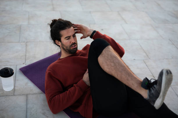 istock Handsome man working stretching exercises in early morning. 1495046906