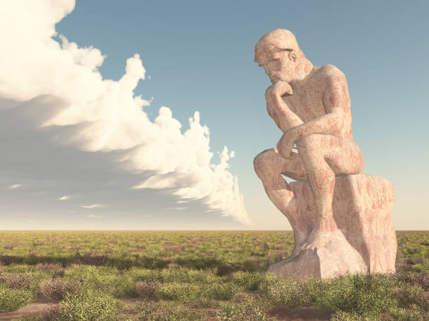Thinker sculpture in a landscape stock photo