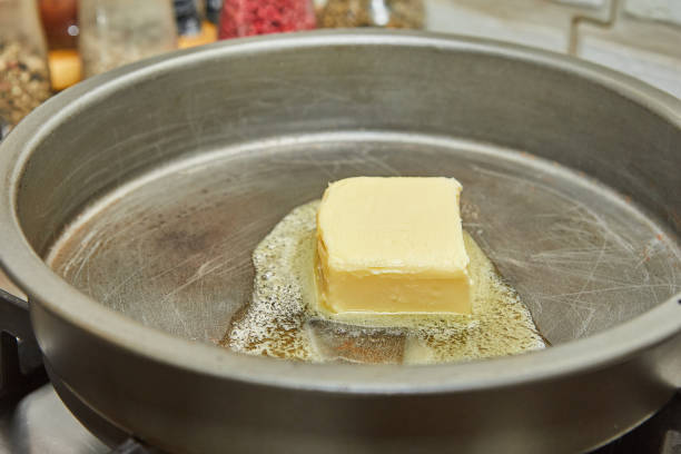 istock Butter is melted in frying pan over low heat 1495046969
